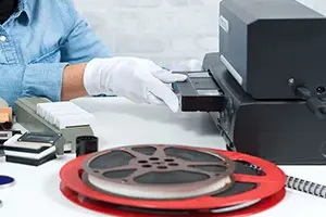 Technician holding a videotape.